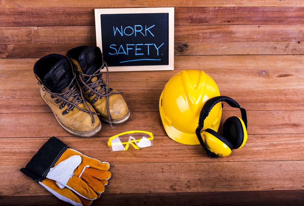 Collection of work equipment with chalkboard saying work safety