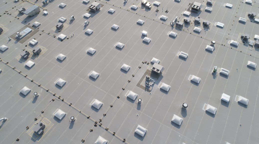An aerial view of the top of a large commercial building.