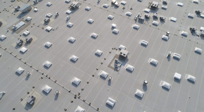 An aerial view of the top of a large commercial building.