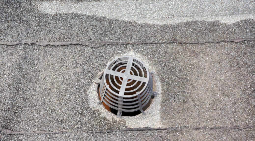 A drain on a commercial roof.