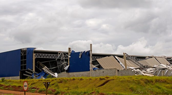 A collapsed commercial building after a storm.