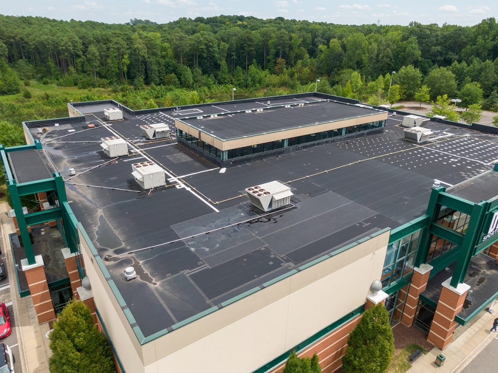 A drone’s-eye-view of a commercial building and its roof membrane.