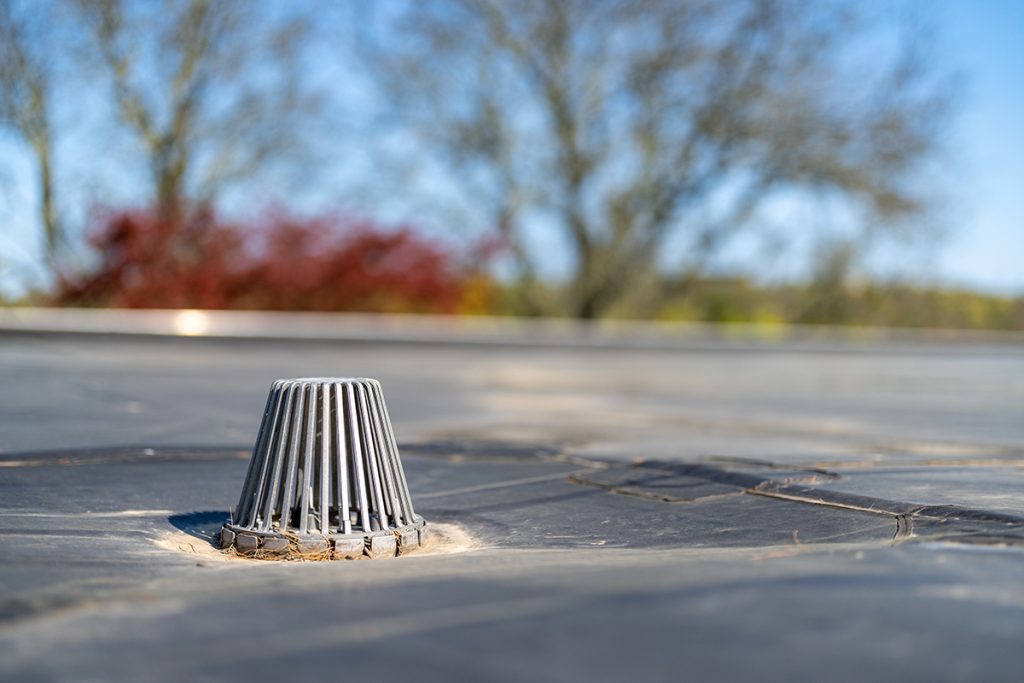 a close-up view of a commercial roof drain